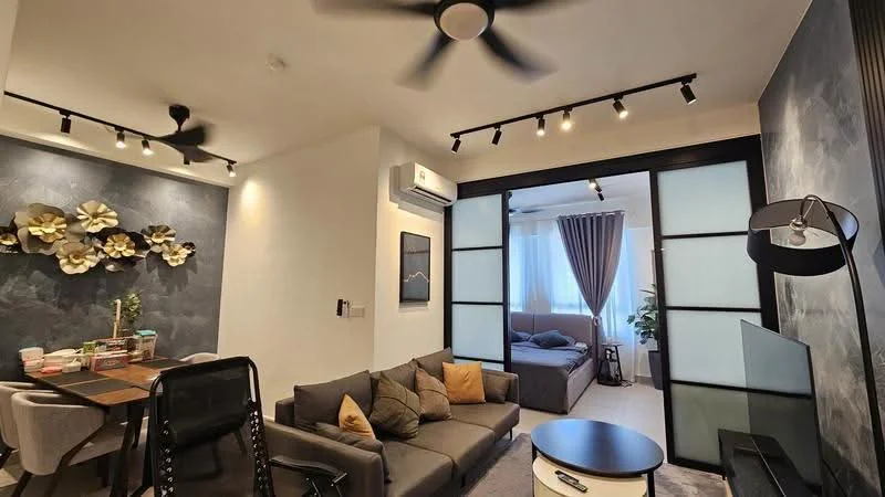 Living features: 3-seater fabric sofa in grey, decorative cushions in various colors, coffee table, wall-mounted TV, ceiling fan with light, track lighting, feature wall with textured finish, sliding glass partition, floor-to-ceiling windows with sheer curtains, light-colored carpet flooring; style: modern. Dining features: 4-seater dining table, upholstered dining chairs, decorative wall art, greenery in vase, open shelving, wall-mounted air conditioning unit; style: modern. Bedroom features: queen-size bed, bedding in neutral tones, bedside table, table lamp, curtains, plant in pot, carpet flooring; style: modern.