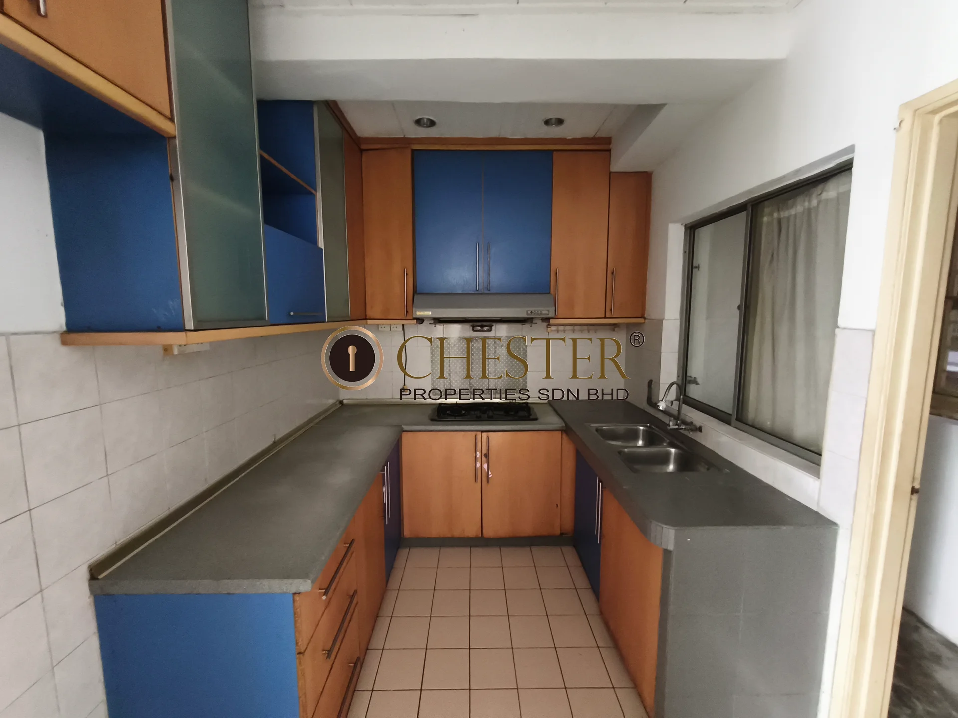 Kitchen features: blue and orange cabinetry, grey countertop, double-bowl stainless-steel sink, chrome pull-down faucet, built-in oven, freestanding range oven, ceramic tile flooring, white tiled backsplash, window with sheer curtains, under-cabinet lighting; style: modern.