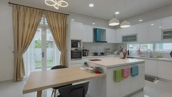 Kitchen features: white cabinetry, marble countertop, island with seating, stainless-steel built-in oven, stainless-steel microwave, 4-burner gas hob, stainless-steel range hood, double-bowl stainless-steel sink, chrome pull-down faucet, pendant lighting, recessed downlights, floor-to-ceiling windows, sliding glass door, cream curtains, light grey walls, white tile backsplash; style: modern; view: garden.