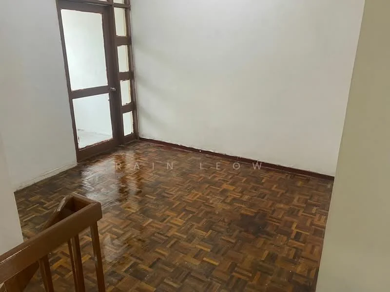 Room features: wooden flooring, white painted walls, brown wooden door, large window, staircase, natural light.
