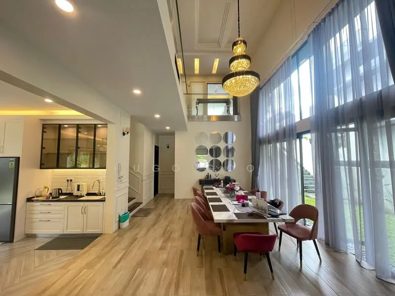 Dining features: large dining table, upholstered dining chairs in pink, chandelier with multiple bulbs, floor-to-ceiling windows, wooden flooring, recessed ceiling lights, decorative wall mirrors, open-plan layout with kitchen, natural light from windows, curtains, high ceiling; style: modern; view: garden. Kitchen features: white cabinetry, stainless-steel fridge, built-in oven, microwave, kitchen island, countertop with bar seating, black glass backsplash, sink, kettle, toaster; style: modern.