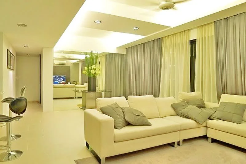 Living features: L-shape sectional sofa in cream, decorative cushions in grey, area rug in light beige, glass coffee table, floor-to-ceiling windows with sheer curtains, grey drapes, recessed downlights, ceiling fan, wall-mounted TV, wall art, light-coloured walls, polished tile flooring; style: modern.