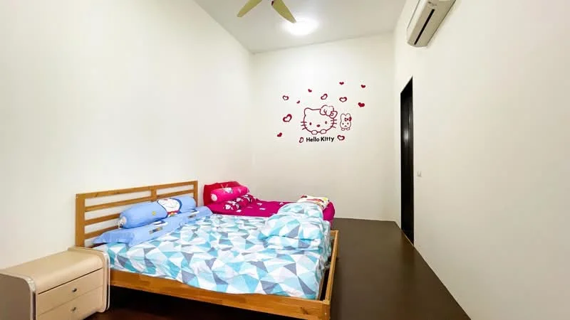 Bedroom features: two beds with wooden frames, blue bedding with geometric pattern, pink bedding with Hello Kitty design, wooden flooring, white painted walls, ceiling fan, wall-mounted split AC, decorative wall decals, nightstand, black door; style: modern.