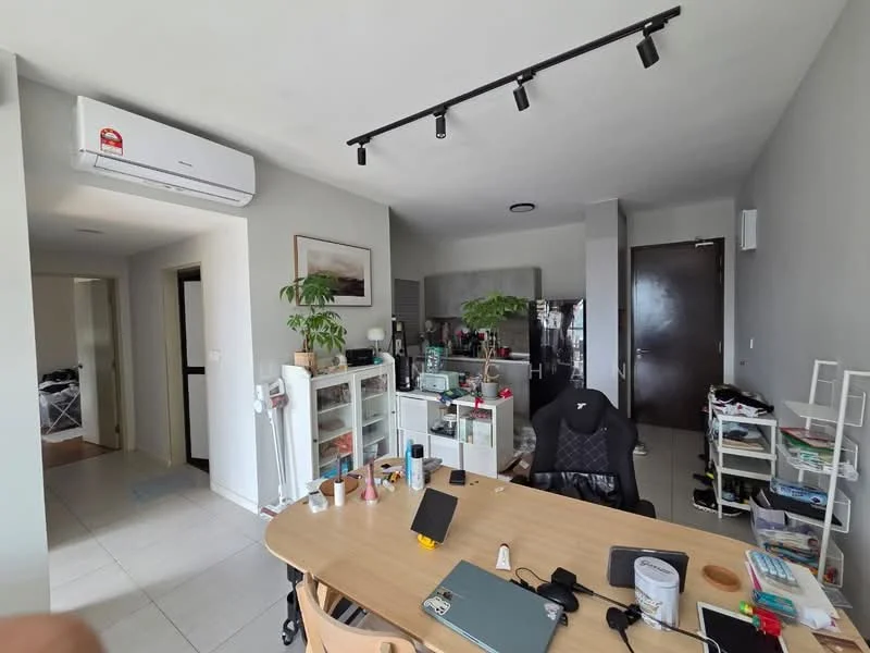 Living features: light grey painted walls, tile flooring, 5-blade ceiling fan with light, track lighting, dining table with chairs, open shelving unit, air conditioning unit, decorative plant, laptop on table, kitchen area visible in background, black office chair, kitchen cabinets visible, laundry area visible through doorway; style: modern.