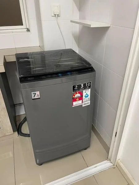 Laundry features: top-load washing machine, grey exterior, 7.5 kg capacity, control panel with buttons, plastic wrap covering, white tiled walls, light grey floor tiles, shelf above washing machine; style: modern.