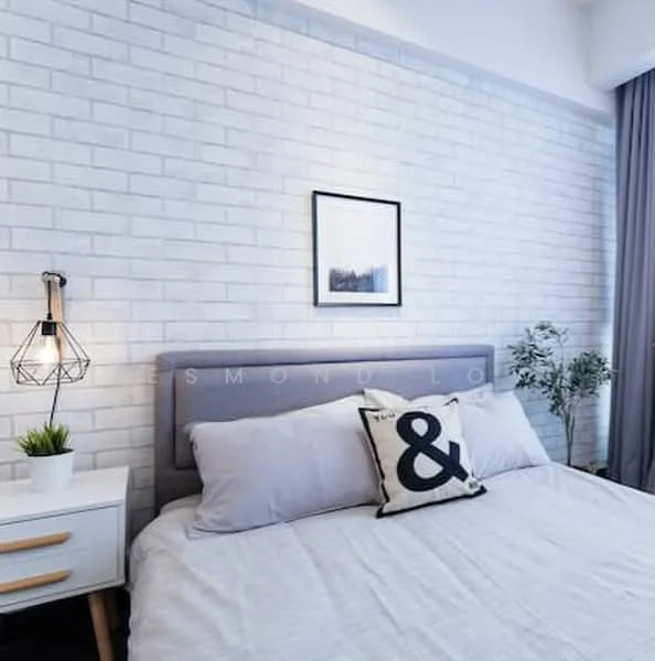Bedroom features: white painted walls, exposed brick accent wall, queen-size bed, upholstered headboard, bedside table with drawer, pendant light fixture, framed artwork on wall, decorative pillow with ampersand design, curtains, indoor plant in ceramic pot; style: modern.