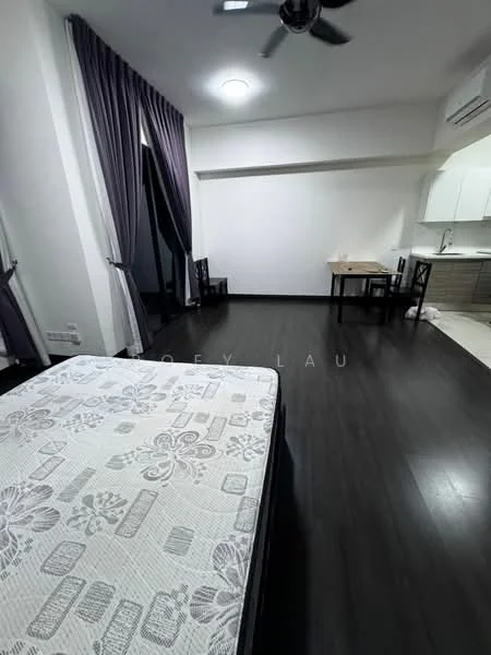 Room features: dark wood laminate flooring, white painted walls, ceiling fan, floor-to-ceiling windows with sheer curtains, kitchenette with grey cabinetry, small dining table with chairs, queen-size bed with mattress, decorative wall with no visible artwork; style: modern.