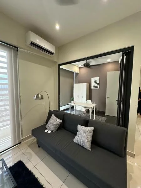 Living features: grey fabric sofa, 2 decorative cushions, glass coffee table, white walls, recessed downlights, wall-mounted split AC, floor-to-ceiling windows with sheer curtains, tile flooring, area rug with geometric pattern; style: modern; view: city. Room features: doorway leading to another room, dark accent wall, white cabinetry, ceiling fan.