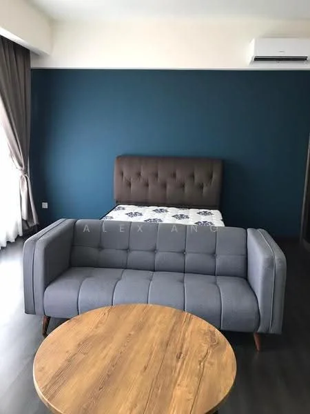 Living features: grey fabric sofa, round wooden coffee table, brown upholstered headboard, white bedding, blue accent wall, curtains, wall-mounted air conditioning unit, dark wood flooring; style: modern.