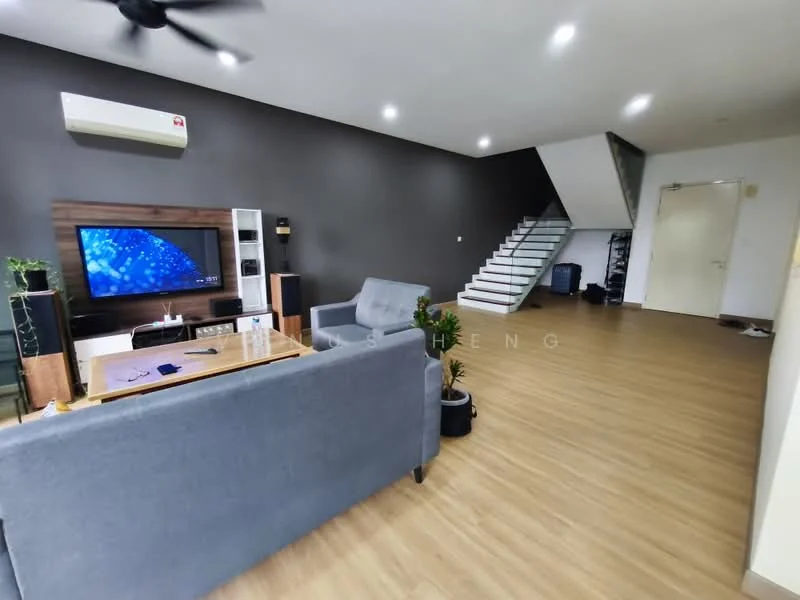 Living features: grey fabric sofa, wood coffee table, wall-mounted TV, TV console, ceiling fan, laminate flooring, white walls, dark accent wall, decorative plants, staircase in background; style: modern.