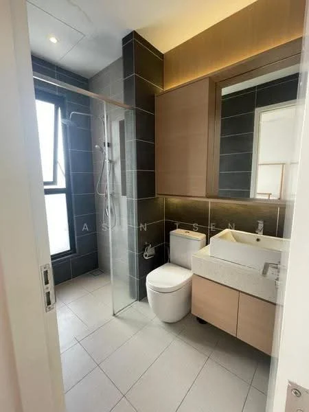 Bathroom features: glass shower enclosure, rain shower head, handheld shower, single-sink vanity with wood cabinet, white ceramic basin, chrome basin mixer, one-piece toilet, grey tiled walls, light grey floor tiles, backlit mirror, recessed lighting, wood cabinetry, wall-mounted towel holder; style: modern.