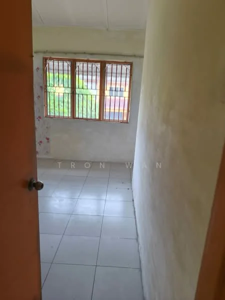 Room features: plain white walls, tile flooring, window with wooden grille, natural light from window, no visible furniture, minimal decor, single door entrance, corner room; style: minimalist; view: garden.