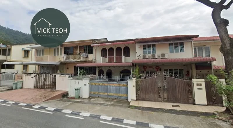 Exterior type: linked terrace house; features: two-storey building, red tiled roof, cream painted facade, balconies with decorative arches, wooden gate, stone-paved walkway, multiple air conditioning units visible, manicured front garden, driveway with interlocking pavers, surrounded by greenery; style: traditional.