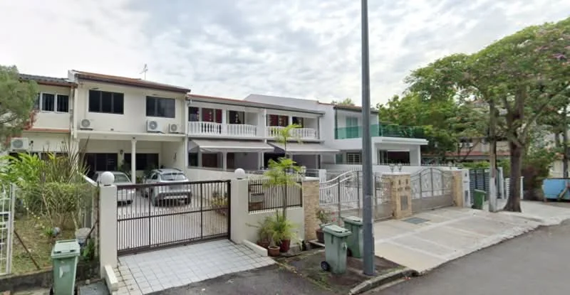 Exterior type: linked terrace house; features: two-storey building, white painted facade, balconies on upper level, gated entrance, manicured landscaping, driveway with interlocking pavers, multiple wall-mounted split AC units, front porch area, surrounded by greenery, street view, car parked in driveway; style: modern.