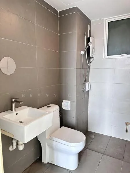 Bathroom features: grey tiled walls, white ceramic sink, chrome faucet, white toilet, shower with wall-mounted showerhead, small window for natural light, grey tiled flooring, exposed plumbing under sink; style: modern.