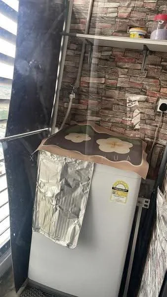 Laundry features: top-load washing machine, metallic foil cover on washing machine, brick-patterned wallpaper, shelving above washing machine, plumbing fixtures visible, window with horizontal slats; style: modern.
