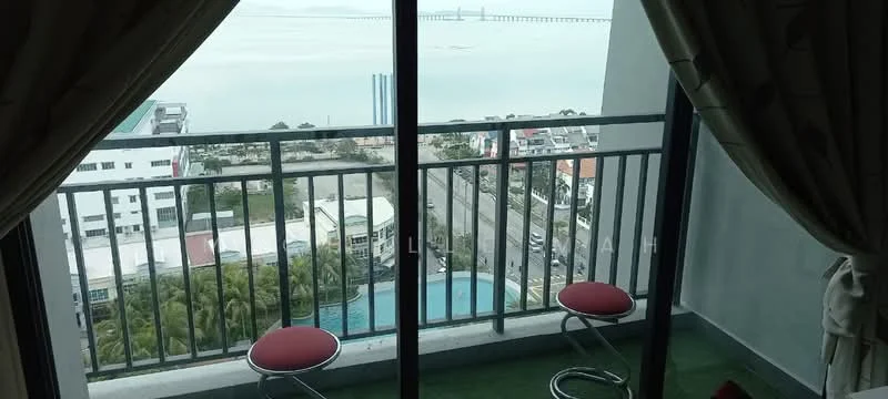 Balcony features: glass sliding door, metal railing, two red stools, green carpet flooring, curtains, view of the sea, view of the city, view of the swimming pool; view: sea.