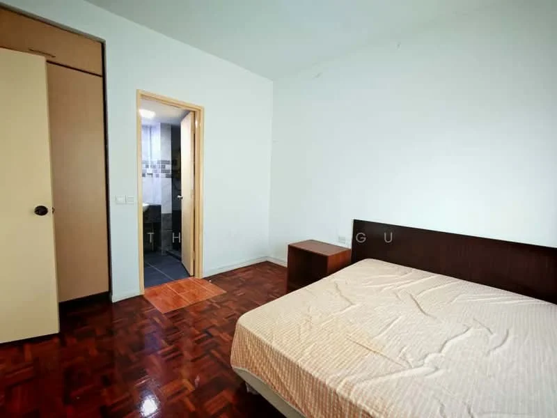 Bedroom features: parquet wood flooring, white painted walls, single bed, wooden bedside table, built-in wardrobe, doorway leading to bathroom, window with no visible treatment.