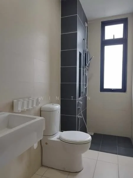 Bathroom features: white ceramic toilet, single-sink vanity with wall-mounted cabinet, chrome basin mixer faucet, walk-in shower with glass enclosure, handheld shower, black tiled accent wall, light-colored wall tiles, grey floor tiles, window for natural light; style: modern.