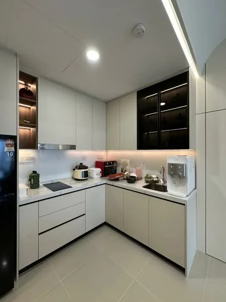 Kitchen features: white cabinetry with flat-panel doors, black upper cabinets with glass fronts, marble countertop, built-in induction cooktop, stainless-steel range hood, stainless-steel sink, chrome pull-down faucet, built-in microwave, coffee machine, rice cooker, toaster, decorative lighting under cabinets, tile flooring in light grey, recessed ceiling lights; style: modern.
