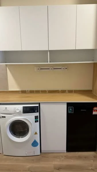 Laundry features: front-load washing machine, black fridge, white cabinetry, wood countertop, light-colored walls, laminate flooring, open shelving above appliances; style: modern.