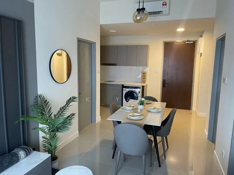 Dining features: 4-seater dining table, upholstered dining chairs in grey, pendant light fixture, wall-mounted air conditioning unit, mirror on wall, plant in ceramic pot, grey cabinetry, washing machine, kitchen counter with cabinets, light-colored tiled flooring, neutral wall color; style: modern. Kitchen features: grey cabinetry, kitchen counter, washing machine, light-colored tiled flooring; style: modern.