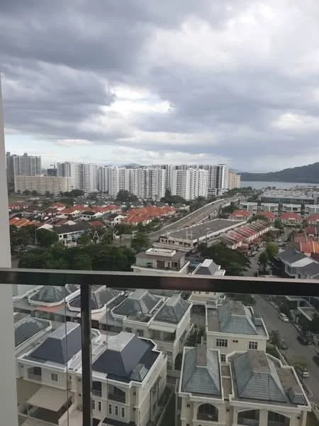 Exterior type: high-rise condominium; features: city skyline view, surrounded by residential buildings, rooftops of low-rise houses, urban landscape, cloudy sky, balcony railing visible; style: modern.