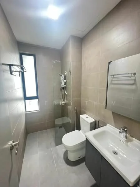 Bathroom features: grey tiled walls, light grey tiled flooring, walk-in shower with glass enclosure, rain shower head, handheld shower, single-sink vanity with grey cabinet, chrome basin mixer faucet, framed mirror, one-piece toilet, window for natural light, towel rack, shower caddy; style: modern.