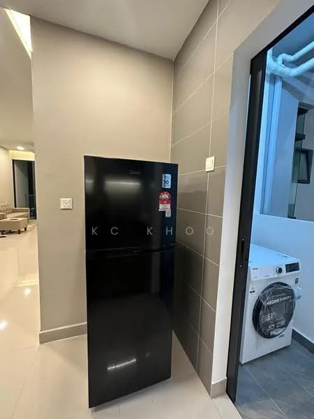 Room features: black fridge, white front-load washing machine, grey tiled walls, white tiled flooring, corner placement, doorway leading outside, light from adjacent room; style: modern.