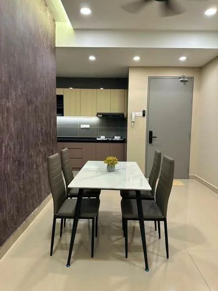 Dining features: 4-seater dining table with marble top, grey upholstered dining chairs, cream painted walls, dark accent wall, recessed LED downlights, kitchen area visible in background, tile flooring, wall-mounted intercom, door with handle, open layout; style: modern.