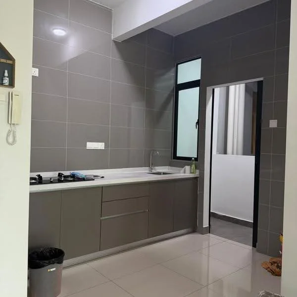 Kitchen features: grey tiled walls, white countertop, single-bowl stainless-steel sink, chrome pull-down faucet, built-in gas hob, grey cabinetry, floor-to-ceiling window, ceramic tile flooring, waste bin, doorway to adjacent room; style: modern.