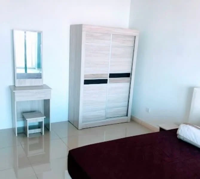 Bedroom features: queen-size bed with maroon bedding, light-colored wooden wardrobe with sliding doors, light-colored wooden dressing table with mirror, small wooden stool, glossy tile flooring, white painted walls, large window with natural light, minimalist decor; style: modern.