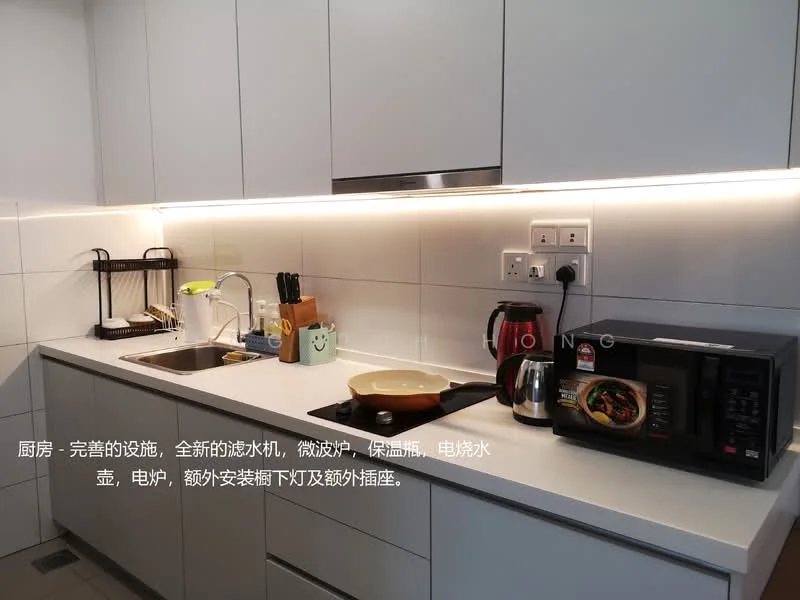 Kitchen features: white cabinetry, grey countertop, single-bowl stainless-steel sink, chrome pull-down faucet, built-in microwave, freestanding kettle, ceramic cooktop, wall-mounted electrical outlets, under-cabinet lighting, tile backsplash, open shelving, decorative plant, pantry storage, dish drying rack; style: modern.