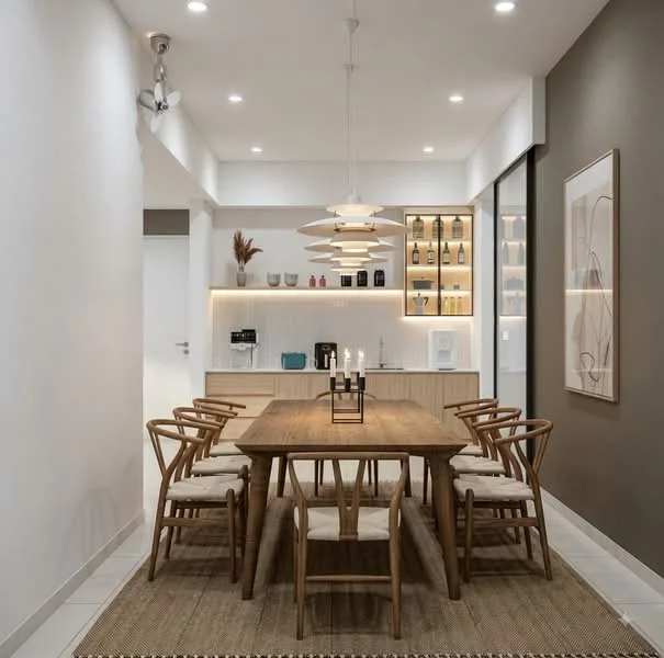 Dining features: wooden dining table, 8 wooden dining chairs with cushions, pendant lighting fixture, recessed ceiling lights, light grey walls, dark accent wall, open shelving with decorative items, built-in cabinetry, floor-to-ceiling windows, woven area rug; style: modern.