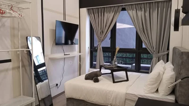 Bedroom features: queen-size bed with white bedding, upholstered headboard, bedside table, decorative tray on bedside table, towels rolled on bed, floor-to-ceiling windows, grey curtains, wall-mounted TV, mirror on stand, clothing rack, wooden flooring, light fixture above bed; style: modern; view: courtyard.