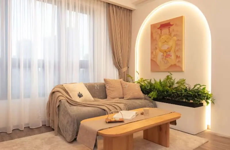 Living features: 3-seater fabric sofa in grey, decorative throw blanket, wood coffee table, framed artwork on wall, floor-to-ceiling sheer curtains, indoor plants in planter, arched wall with integrated lighting, wooden flooring; style: modern.