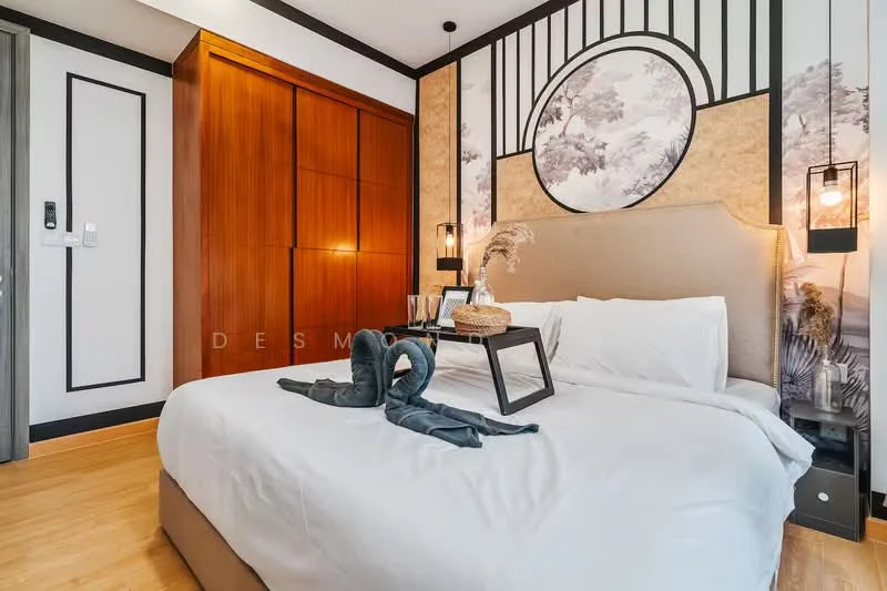 Bedroom features: king-size bed with upholstered headboard, white bedding, decorative throw pillows, wooden wardrobe with sliding doors, wall-mounted bedside lamps, decorative wall art with nature theme, wooden flooring, accent wall with wallpaper, small tray with decorative items on bed, potted plant on bedside table; style: modern.