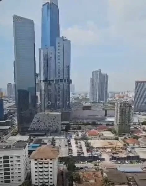 Exterior type: high-rise condominium; features: glass curtain wall, multiple recessed balconies, urban skyline view, surrounded by commercial buildings, parking lot visible, mixed-use development, modern architectural design; style: modern.