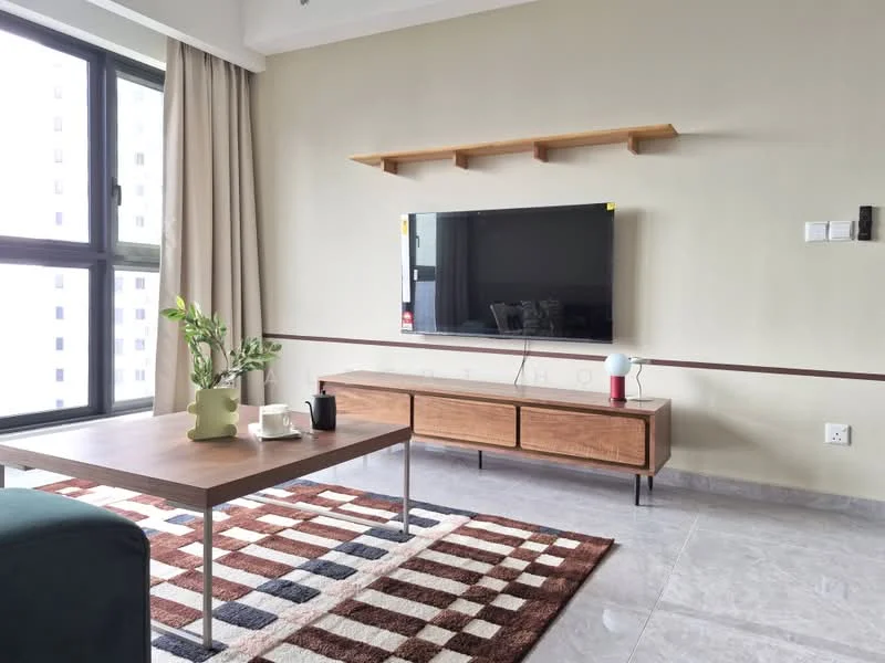 Living features: grey tiled flooring, light beige painted walls, floating wooden shelf, wall-mounted TV, wooden TV console, coffee table with metal legs, area rug with geometric pattern, large windows with sheer curtains, indoor plant in ceramic pot, decorative lamp on table; style: modern.