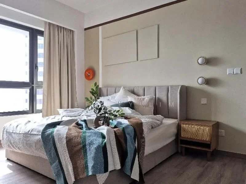 Bedroom features: king-size bed with upholstered headboard, white bedding with decorative throw, striped throw blanket in blue and brown, wooden bedside table, wall-mounted reading lights, large window with sheer curtains, laminate flooring, decorative wall art, green plant in vase; style: modern; view: city.