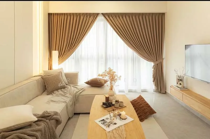 Living features: L-shape sectional sofa in light beige, decorative throw pillows in various textures, wooden coffee table, decorative vase with dried flowers, framed artwork on coffee table, floor-to-ceiling windows with sheer curtains, heavy drapes in a warm brown color, light-colored wall with minimalistic design, wall-mounted TV, light-colored flooring; style: modern.