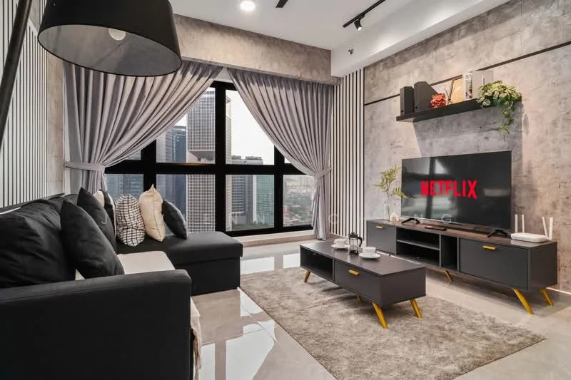 Living features: L-shape sectional sofa in black, decorative cushions in various patterns, coffee table with wooden legs, TV console in dark grey, wall-mounted TV, area rug with neutral color, floor-to-ceiling windows, curtains in light grey, exposed concrete accent wall, recessed downlights, decorative wall shelves, decorative plants; style: modern; view: city.
