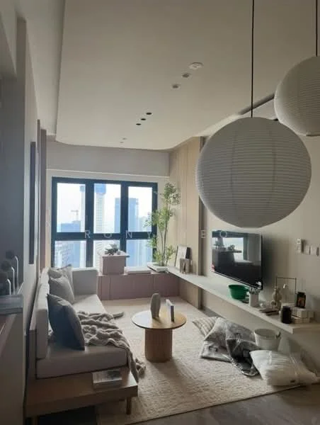 Living features: 3-seater fabric sofa in light grey, coffee table with wooden surface, area rug with neutral tones, wall-mounted TV, built-in shelving unit, large floor-to-ceiling windows, hanging pendant lights, indoor plants, decorative items on shelves, textured wall paneling, throw blanket on sofa, cushions on sofa; style: modern; view: city.