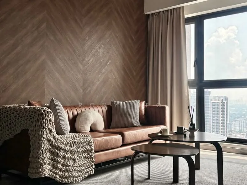 Living features: brown leather sofa, knitted throw blanket, two decorative pillows, coffee table, large window with city view, sheer curtains, herringbone patterned accent wall, area rug; style: modern; view: city.