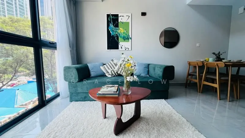 Living features: green fabric sofa, decorative cushions, round wooden coffee table, area rug, floor-to-ceiling windows, city view, wall-mounted mirror, abstract artwork on wall, dining table with chairs in background, grey painted walls, polished tile flooring; style: modern; view: city.