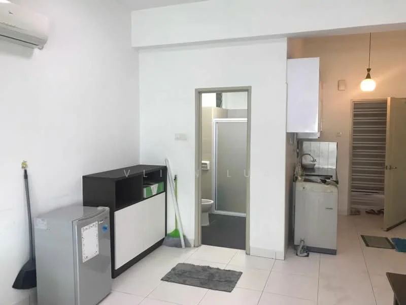 Room features: white painted walls, tile flooring, 1 wall-mounted split AC, recessed downlights, kitchenette with sink, built-in cabinets, door leading to bathroom, door leading to another room, small rug, cleaning supplies visible, fridge, countertop with storage; style: modern.