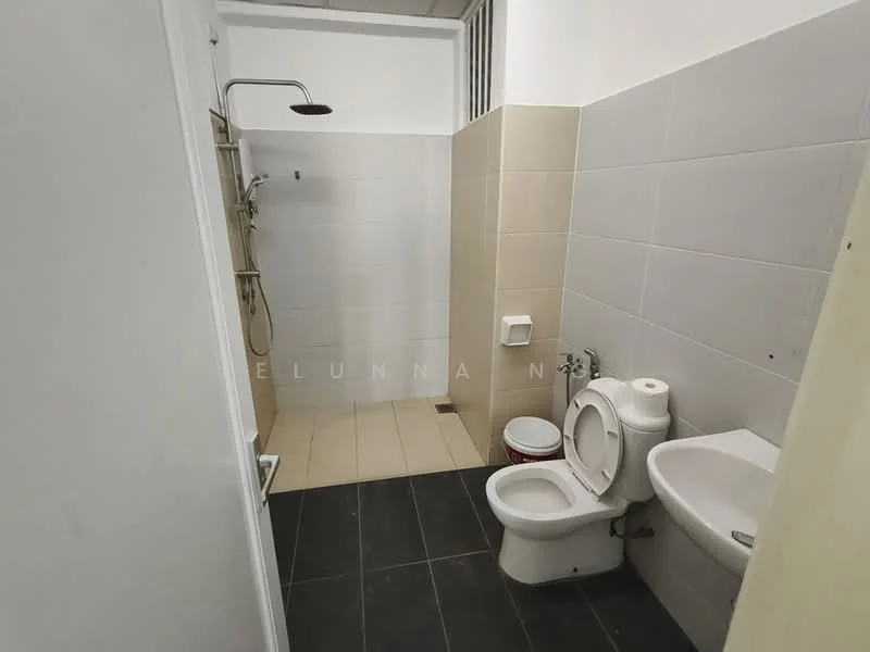 Bathroom features: shower with wall-mounted shower head, toilet, sink with wall-mounted faucet, white tiled walls, grey tiled flooring, shower area with glass partition, toilet paper holder, small waste bin; style: modern.
