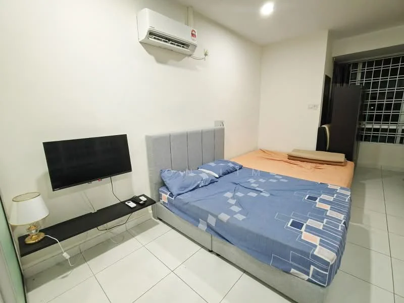 Bedroom features: queen-size bed with blue bedding, grey upholstered headboard, wall-mounted TV, black TV console, 1 bedside lamp with white shade, air conditioning unit, white painted walls, white tiled flooring, window with security bars, foldable mattress on the floor; style: modern.