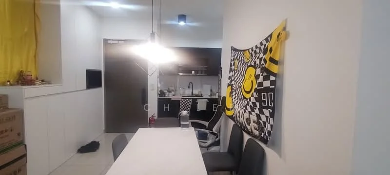 Dining features: white dining table, 4 upholstered dining chairs in grey, pendant light fixture, black and white checkered wall decoration, white walls, tile flooring, open kitchen area visible, kitchen cabinetry in dark colour, sink visible in kitchen area, door leading to hallway, yellow curtain, boxes in the background; style: modern.
