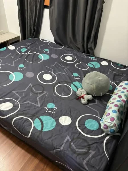 Bedroom features: queen-size bed with patterned bedding, grey curtains, wood laminate flooring, decorative throw pillow, stuffed toy on bed, wall-mounted window, nightstand with minimal decor.